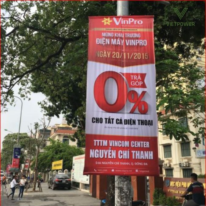 băng rôn khai trương treo cột điện